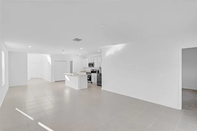 a view of a kitchen with furniture and a window