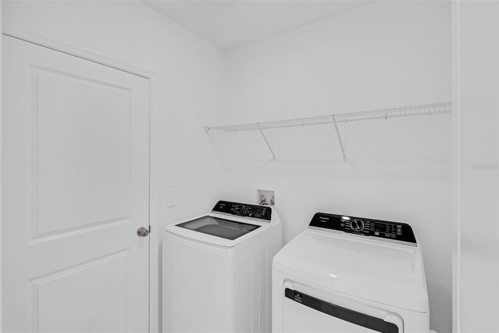 5428 Meadow Walk Drive Davenport, FL 33837 - Photo 12 of 24 a room with storage and utility