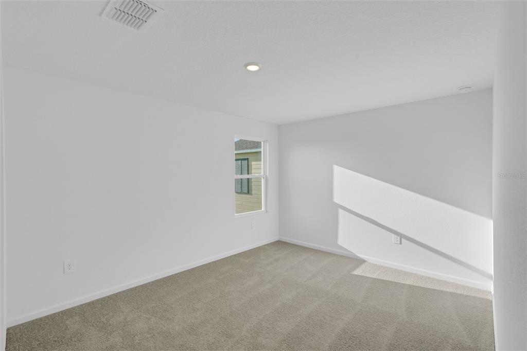 5428 Meadow Walk Drive Davenport, FL 33837 - Photo 18 of 24 an empty room with a workbench