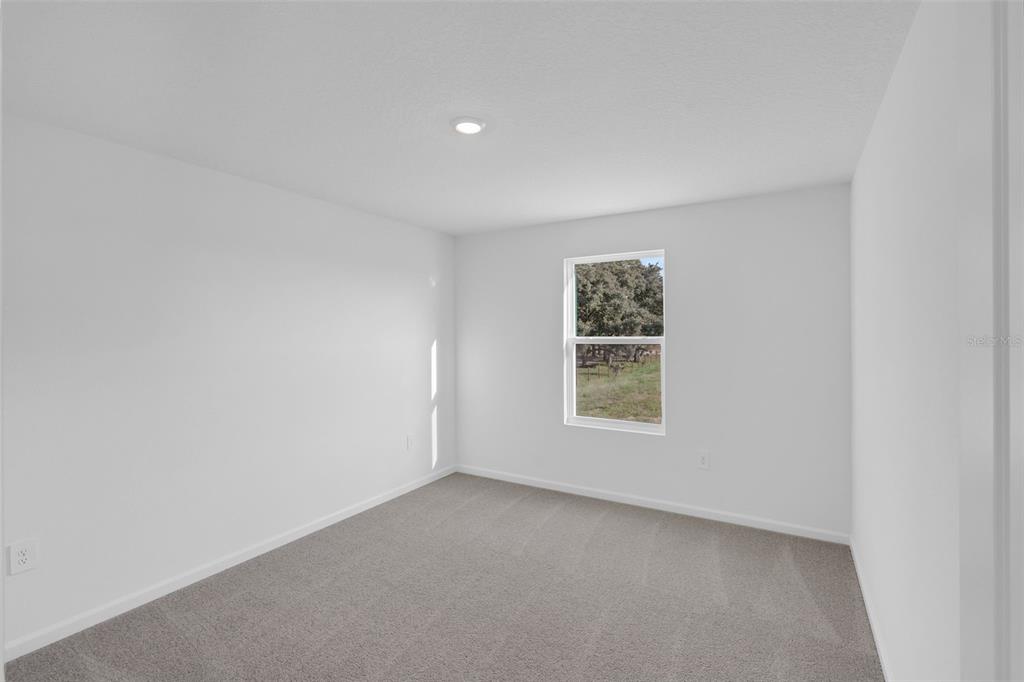 5428 Meadow Walk Drive Davenport, FL 33837 - Photo 21 of 24 an empty room with a window