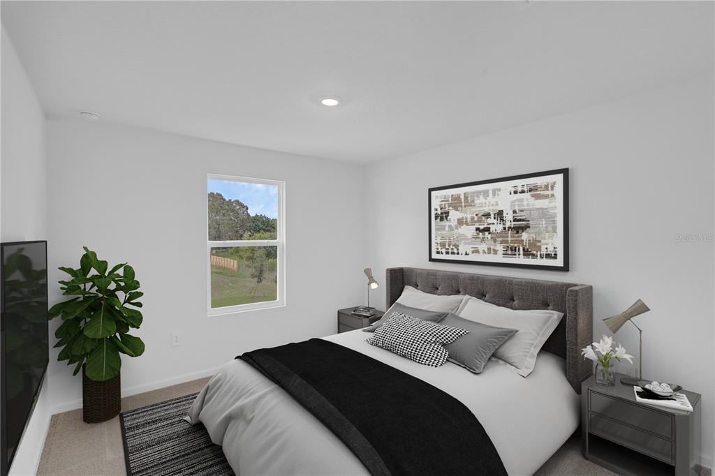 5428 Meadow Walk Drive Davenport, FL 33837 - Photo 6 of 24 a bedroom with bed plant and window