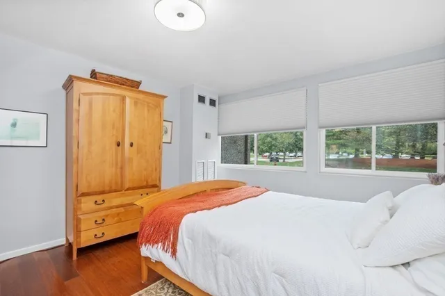 a bed room with a bed and a window