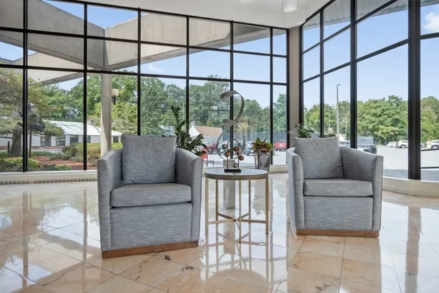 a living room with furniture and a large window
