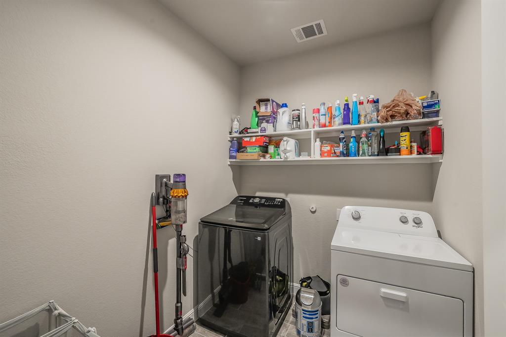 1212 Bosque Lane Weatherford, TX 76087 - Photo 23 of 38 a view of storage and utility room with baby washer and dryer