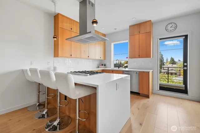 a kitchen with a sink cabinets and window