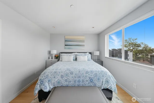 a bedroom with a bed and window