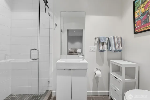 a bathroom with a sink and toilet