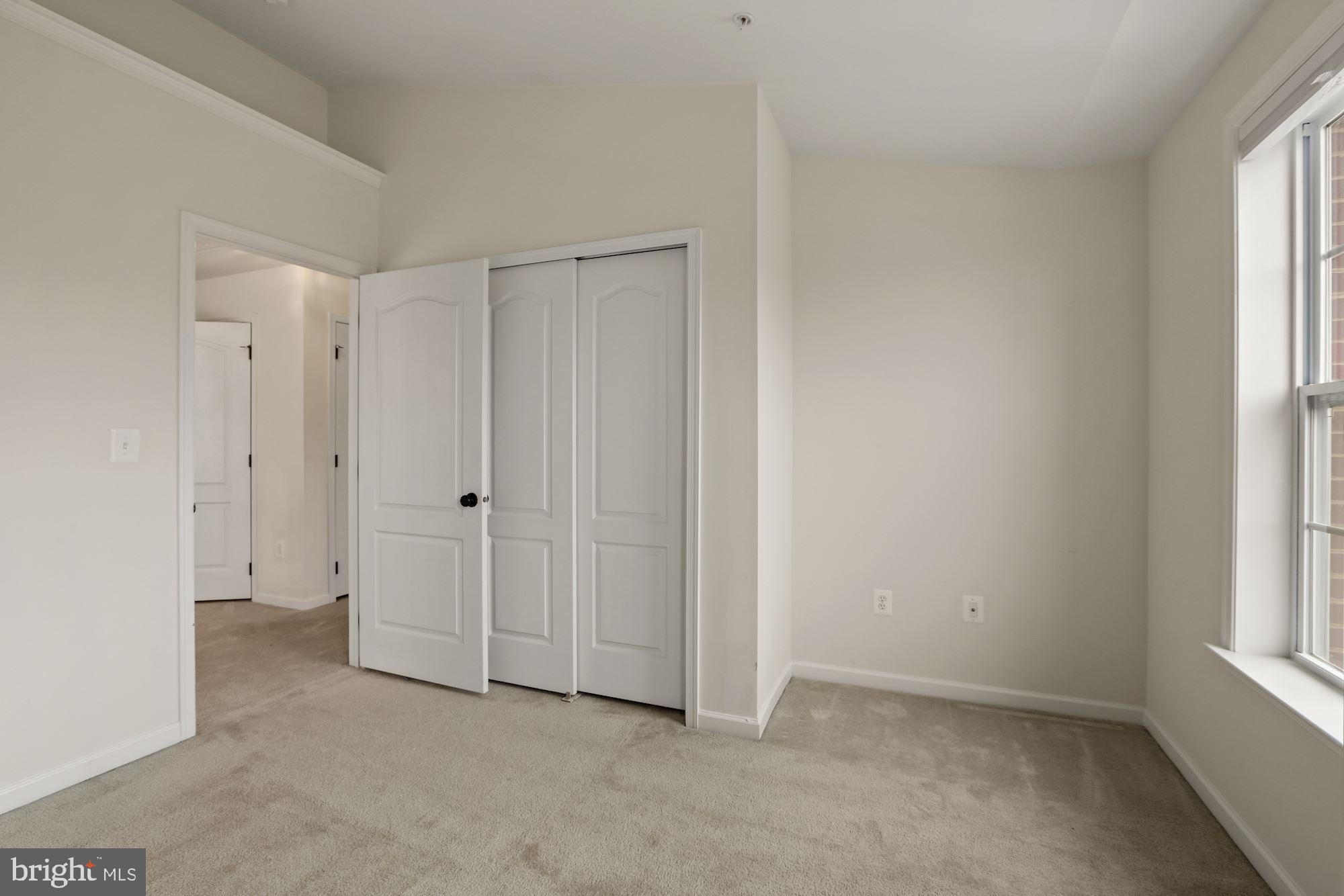 11007 Buggy Path Upper Marlboro, MD 20772 - Photo 11 of 18 a view of an empty room with a window