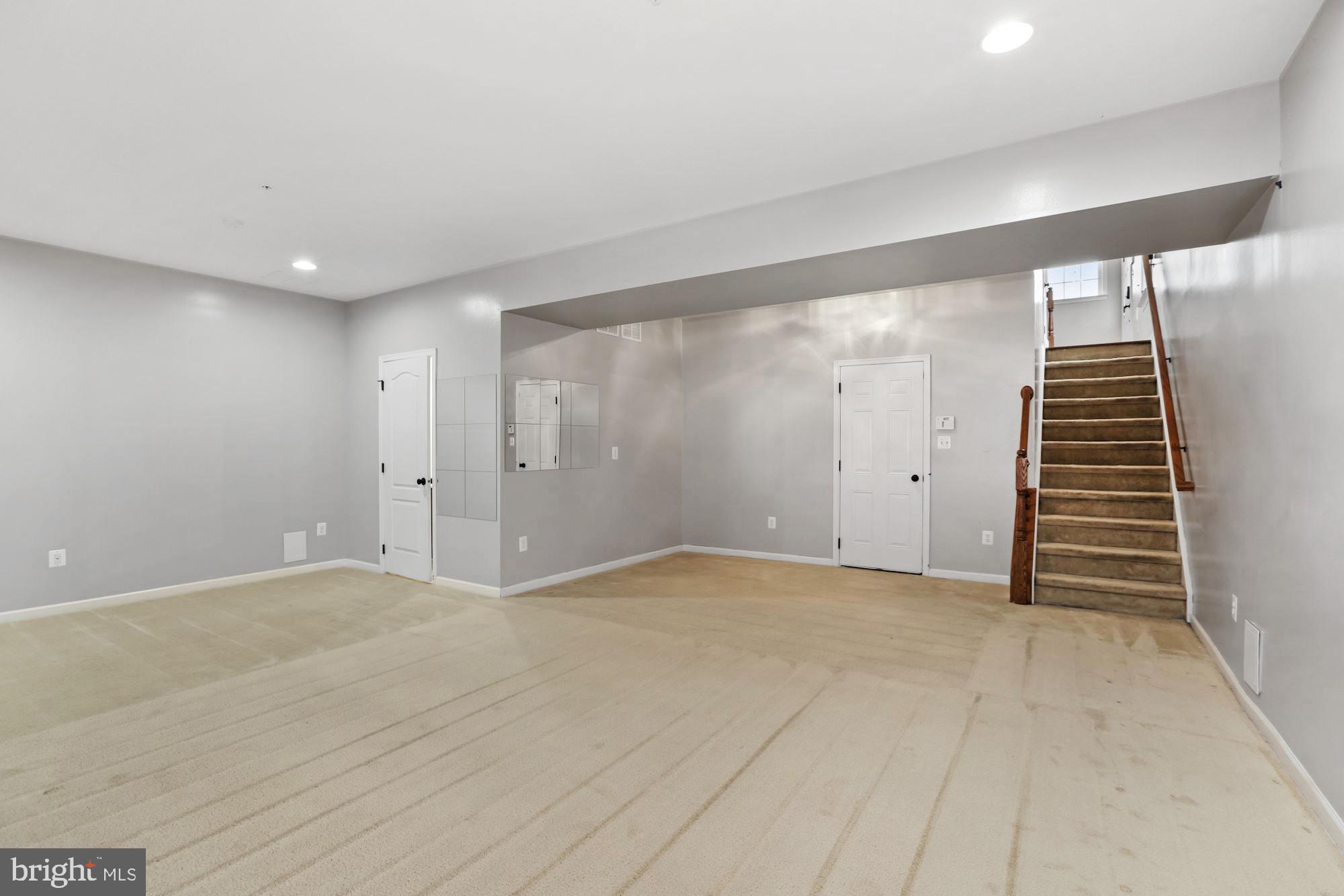 11007 Buggy Path Upper Marlboro, MD 20772 - Photo 13 of 18 a view of an empty room with stairs