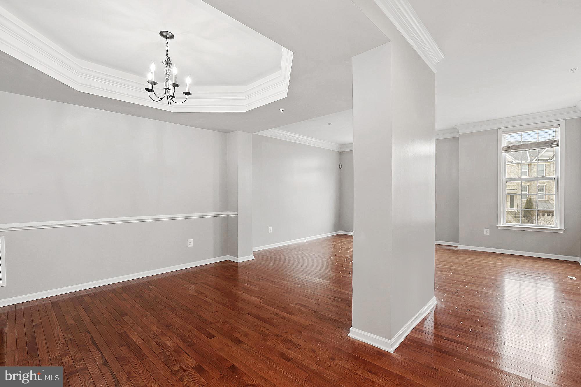 11007 Buggy Path Upper Marlboro, MD 20772 - Photo 3 of 18 wooden floor in an empty room with a window