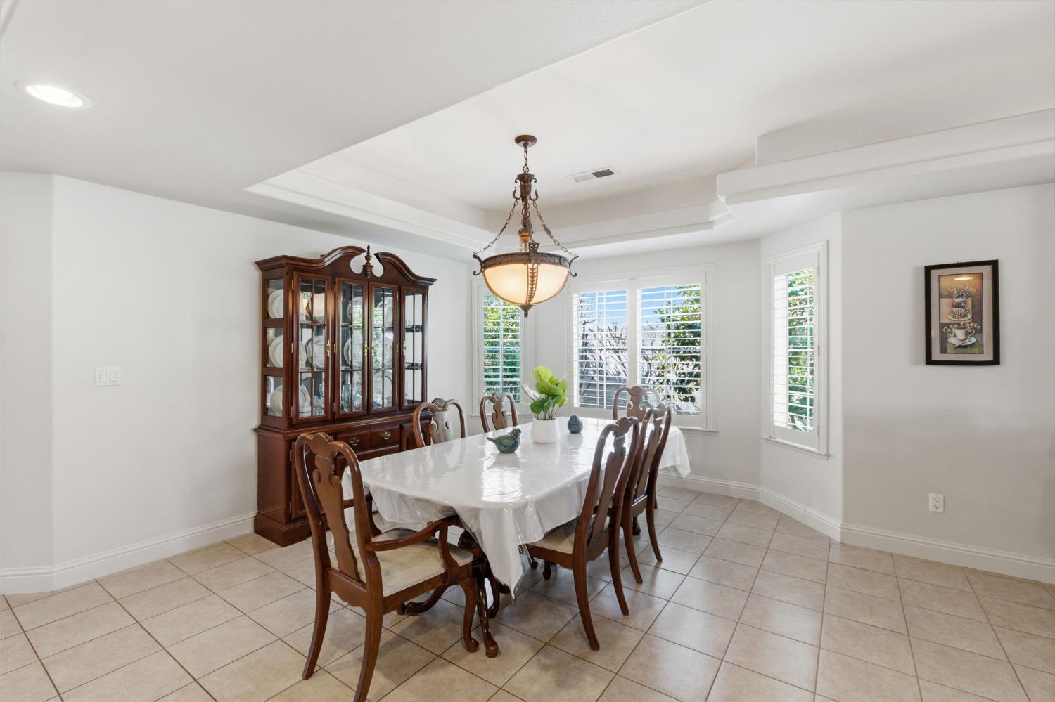 3296 Hollow Avenue Madera, CA 93637 - Photo 12 of 45 a view of a dining room with furniture window and outside view