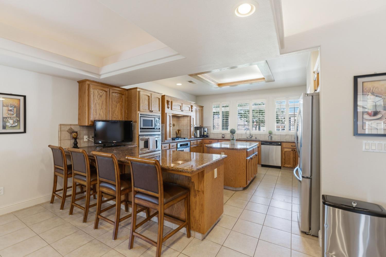 3296 Hollow Avenue Madera, CA 93637 - Photo 13 of 45 a kitchen with a sink a counter top space and appliances