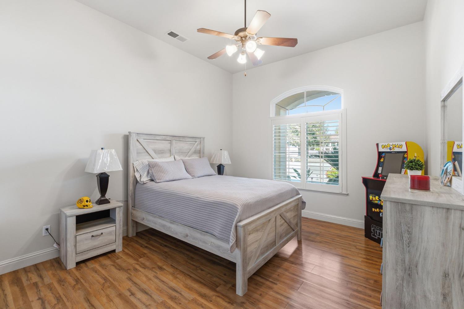 3296 Hollow Avenue Madera, CA 93637 - Photo 17 of 45 a bed room with a bed mirror and a window