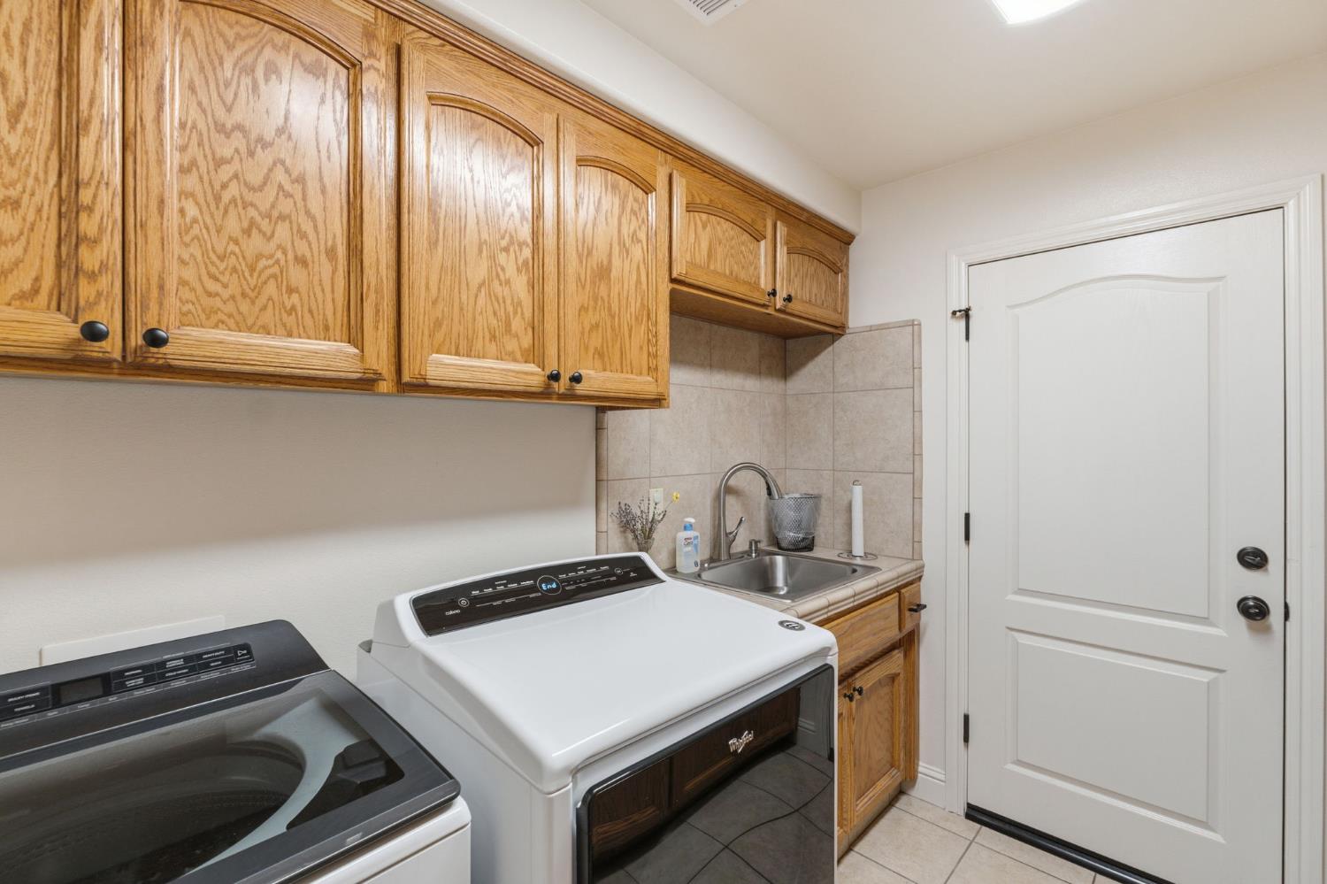 3296 Hollow Avenue Madera, CA 93637 - Photo 20 of 45 a kitchen with a stove and a microwave