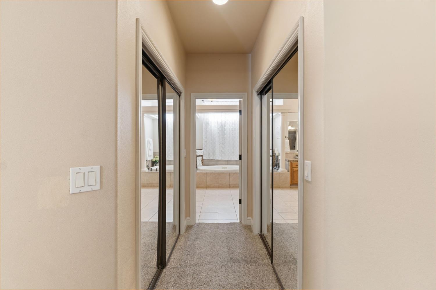3296 Hollow Avenue Madera, CA 93637 - Photo 25 of 45 a view of hallway with a large window and a glass door
