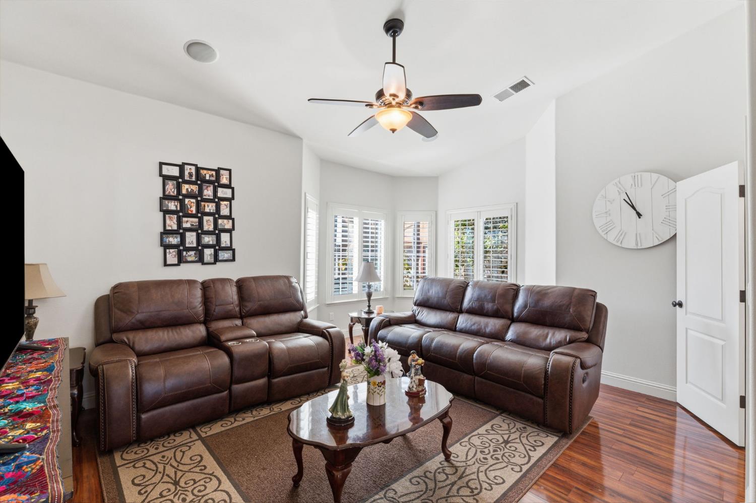 3296 Hollow Avenue Madera, CA 93637 - Photo 28 of 45 a living room with furniture a rug and a window