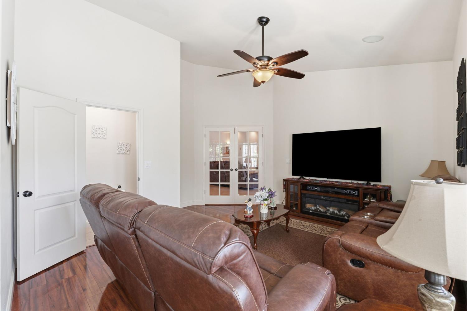 3296 Hollow Avenue Madera, CA 93637 - Photo 29 of 45 a living room with furniture and a flat screen tv