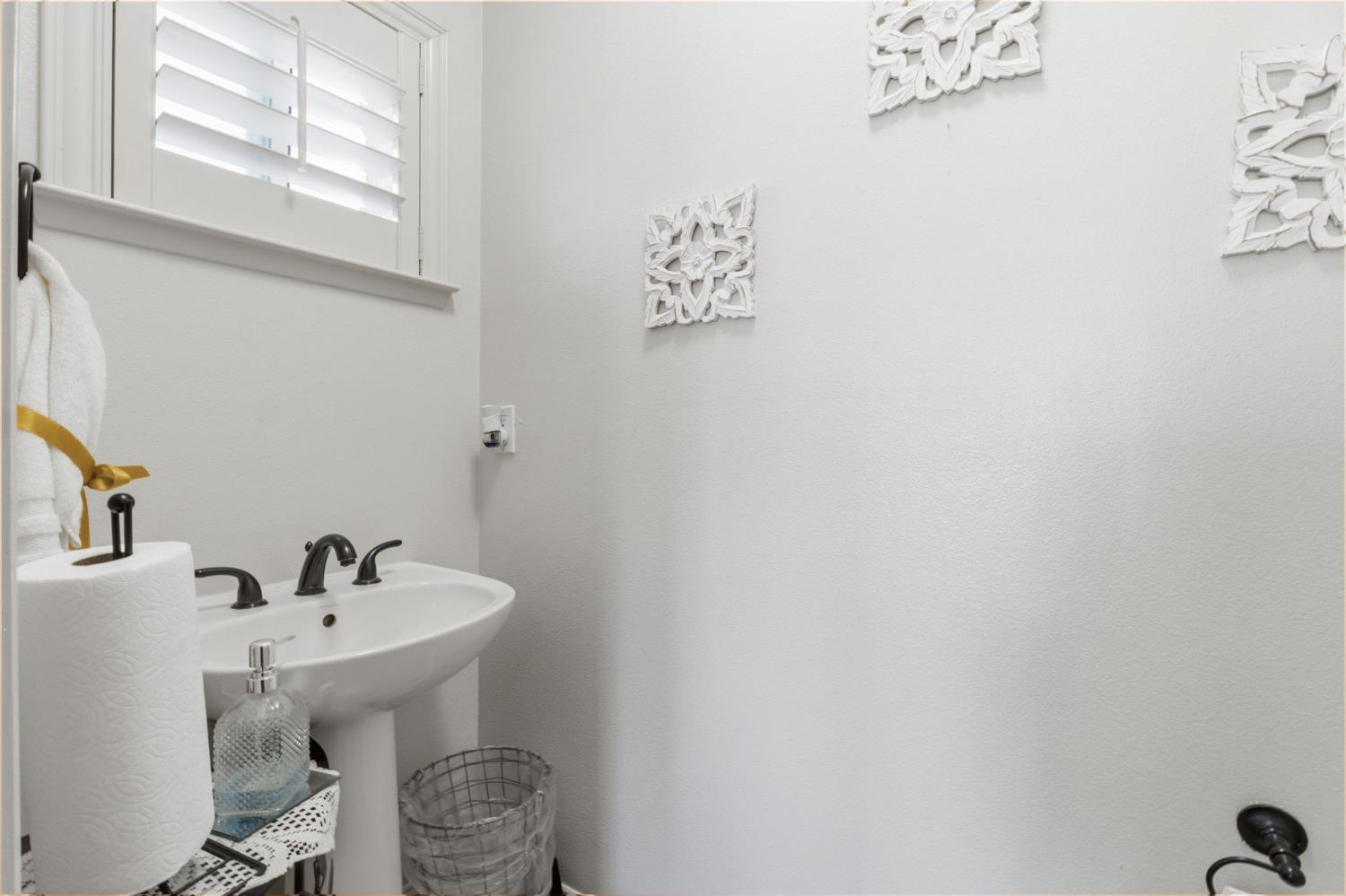 3296 Hollow Avenue Madera, CA 93637 - Photo 30 of 45 a bathroom with a sink and a mirror