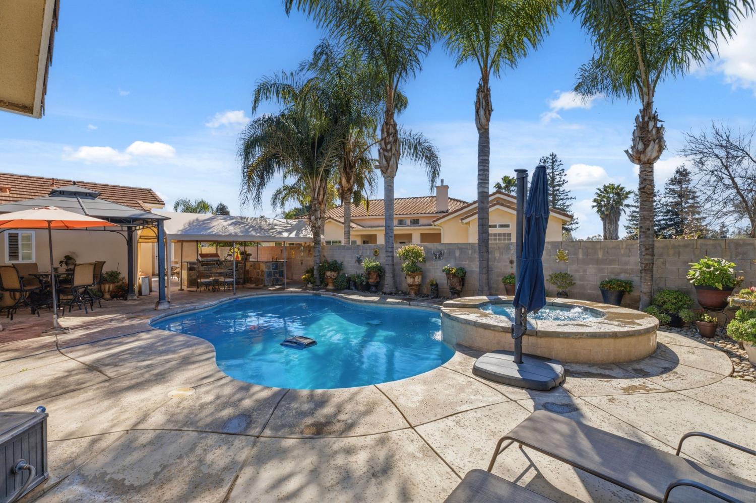 3296 Hollow Avenue Madera, CA 93637 - Photo 34 of 45 a swimming pool with outdoor seating