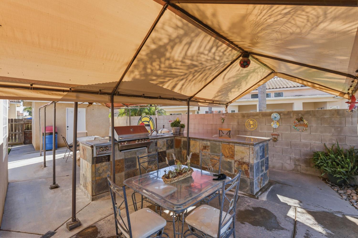 3296 Hollow Avenue Madera, CA 93637 - Photo 38 of 45 a patio with a table and chairs