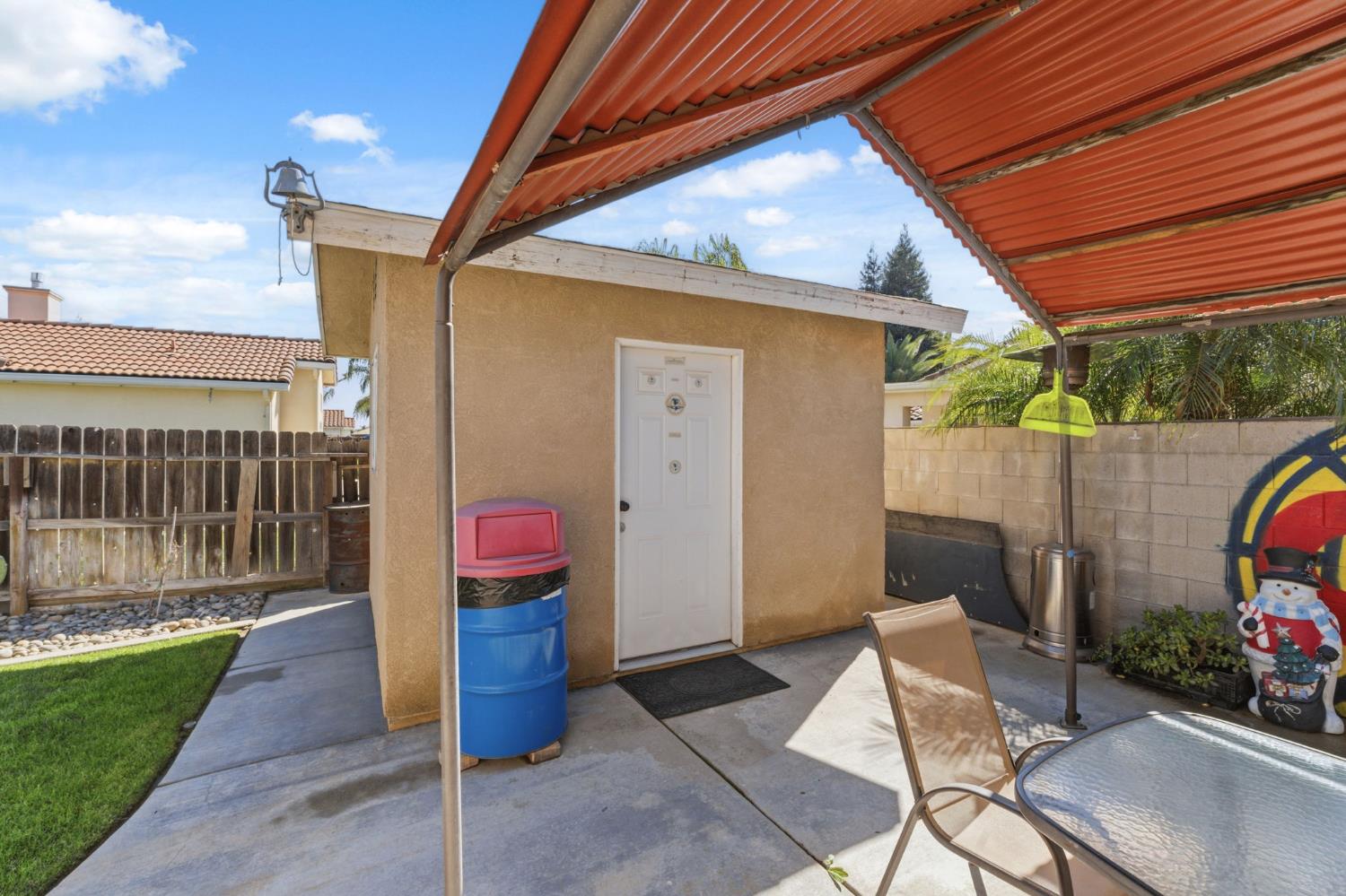 3296 Hollow Avenue Madera, CA 93637 - Photo 39 of 45 a backyard of a house with seating space