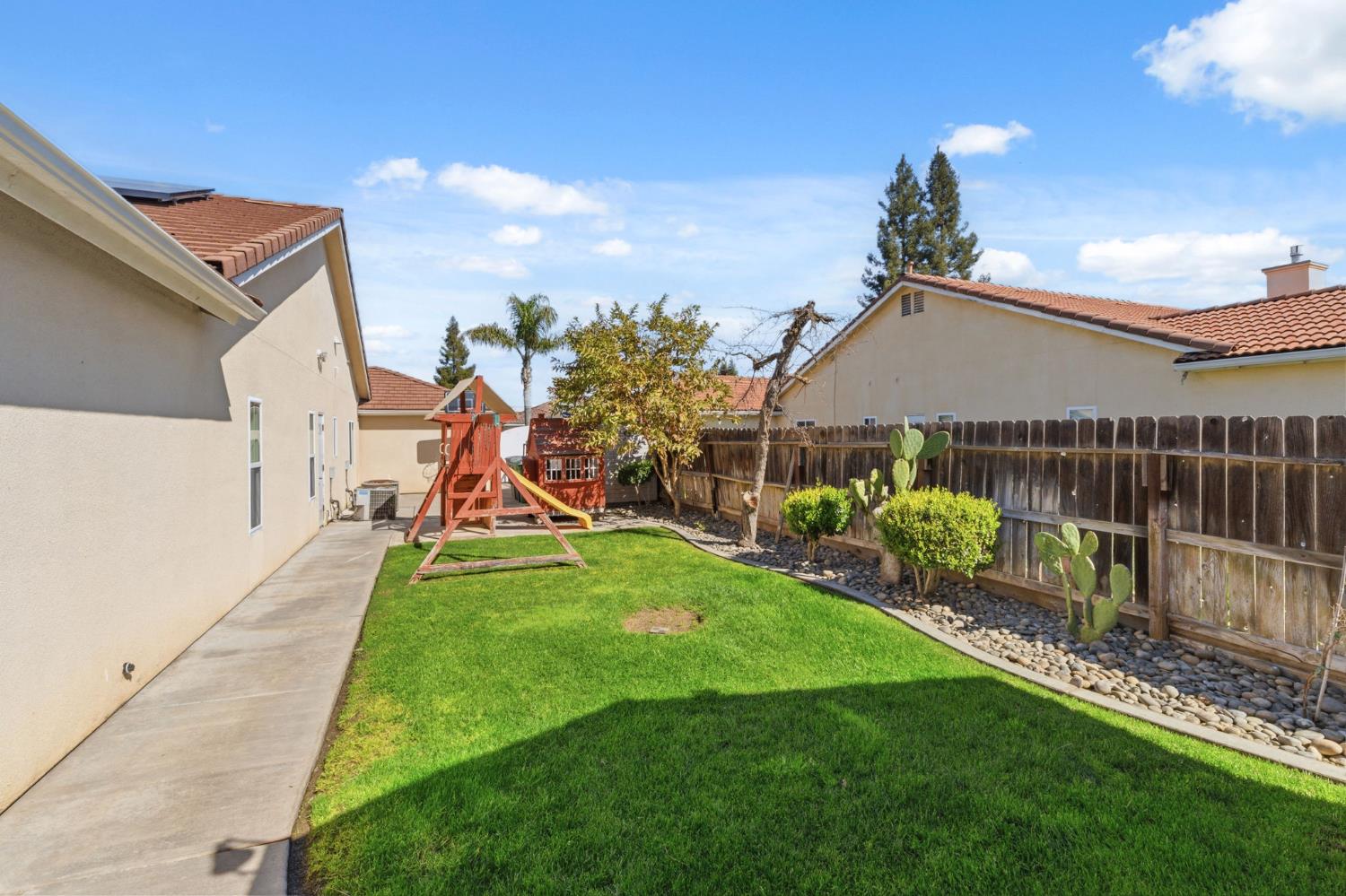 3296 Hollow Avenue Madera, CA 93637 - Photo 41 of 45 a view of an house with backyard space and balcony