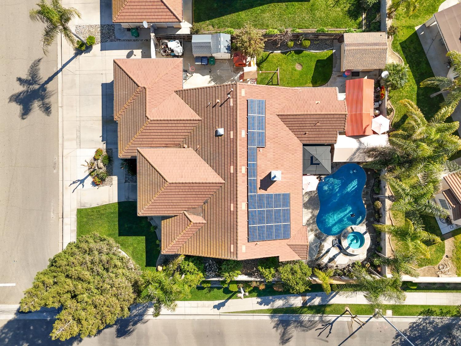 3296 Hollow Avenue Madera, CA 93637 - Photo 44 of 45 an aerial view of a house with a yard and a large tree