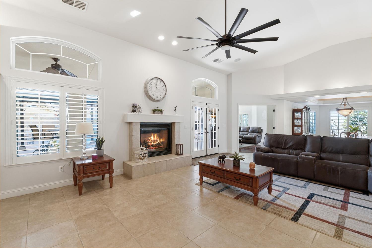 3296 Hollow Avenue Madera, CA 93637 - Photo 10 of 45 a living room with furniture and a fireplace