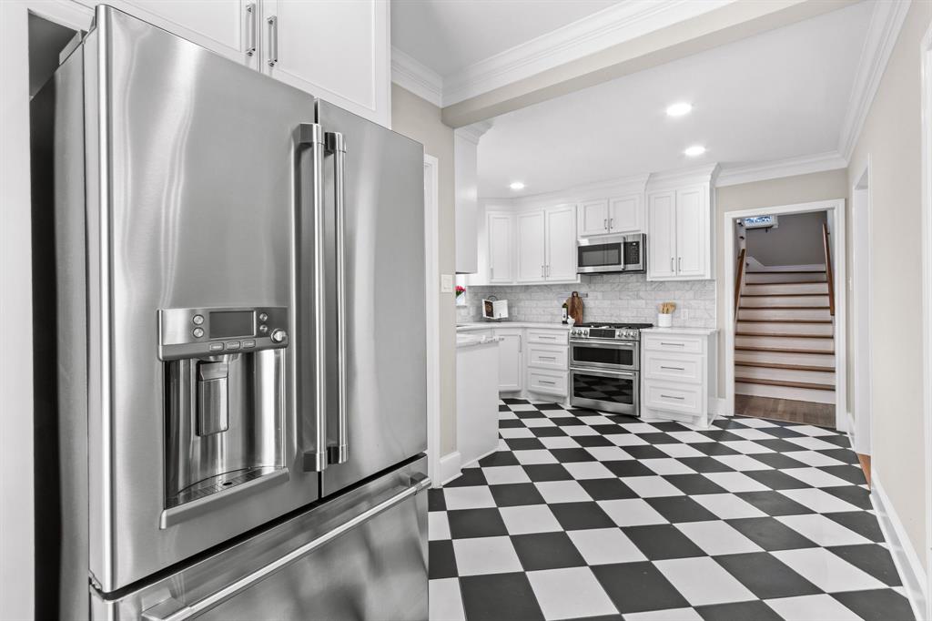 2815 Cumberland Avenue Waco, TX 76708 - Photo 13 of 40 a kitchen with stainless steel appliances granite countertop a refrigerator and a stove top oven