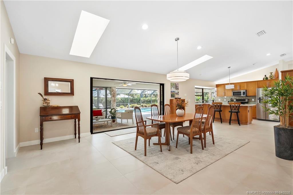 4620 Southeast Quail Trail Stuart, FL 34997 - Photo 10 of 71 a view of a big dining room with furniture window and outside view