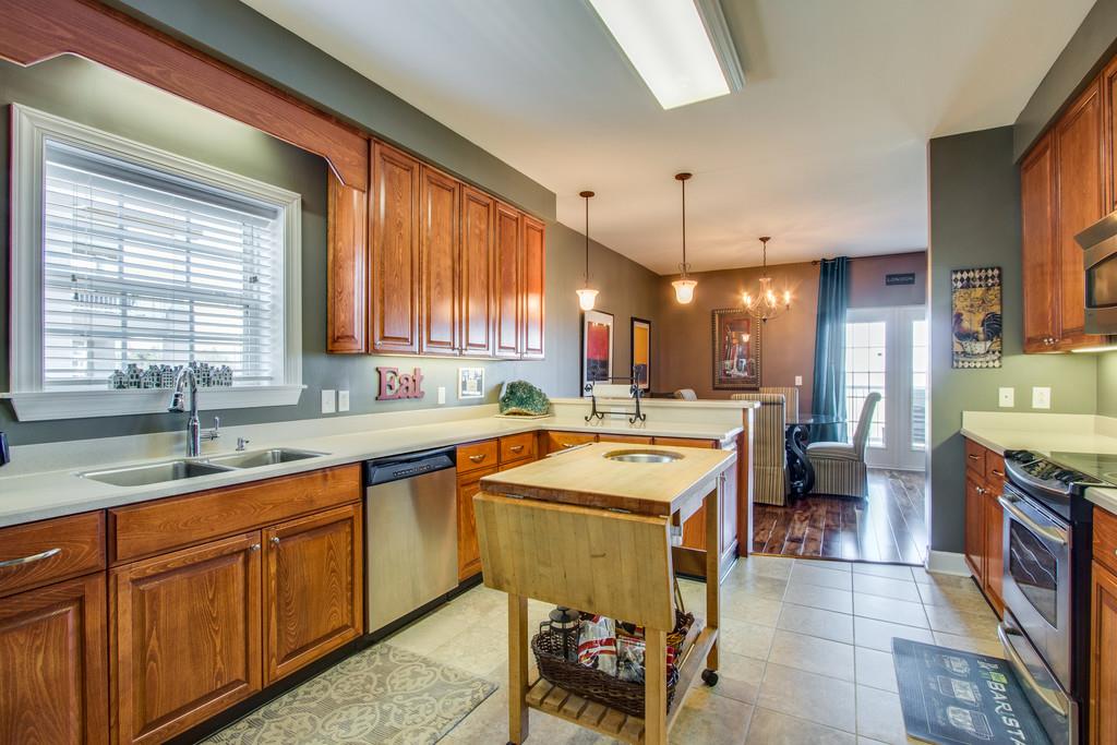 7100 Dale Ridge Road, Unit E3 Lancaster, TN 38569 - Photo 1 of 30 a kitchen with a sink stove and cabinets