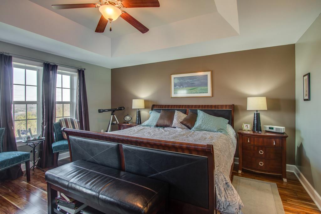 7100 Dale Ridge Road, Unit E3 Lancaster, TN 38569 - Photo 13 of 30 a bedroom with a bed and wooden floor