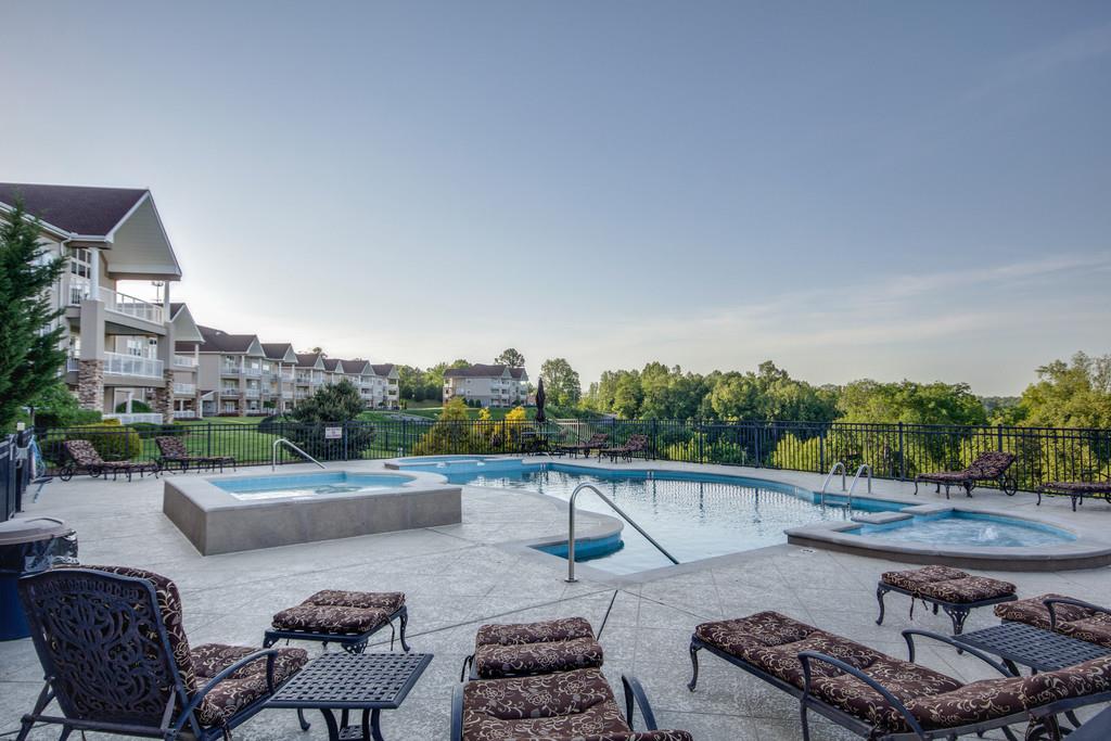 7100 Dale Ridge Road, Unit E3 Lancaster, TN 38569 - Photo 29 of 30 a view of a patio with couches chairs and a fire pit