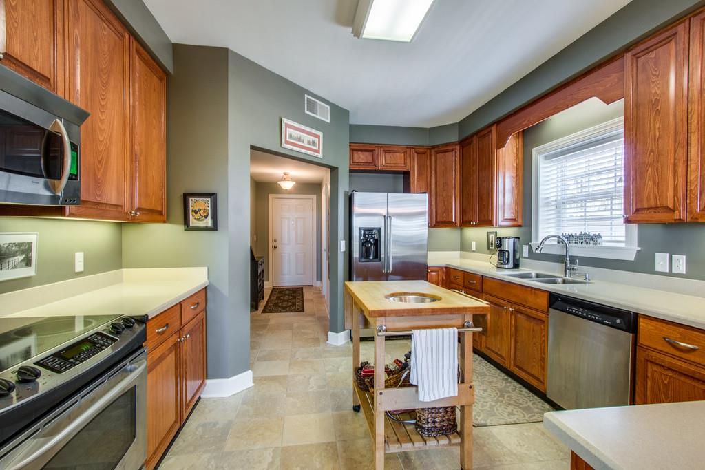 7100 Dale Ridge Road, Unit E3 Lancaster, TN 38569 - Photo 3 of 30 a kitchen with a sink stove top oven and refrigerator