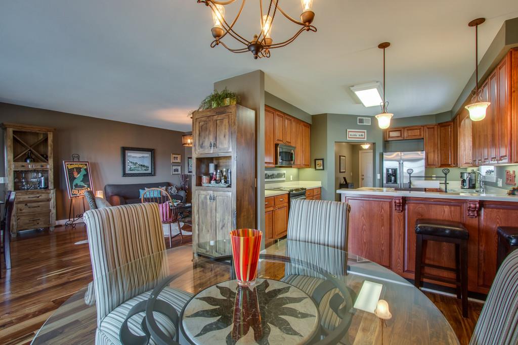 7100 Dale Ridge Road, Unit E3 Lancaster, TN 38569 - Photo 7 of 30 a living room with furniture a dining table and a chandelier