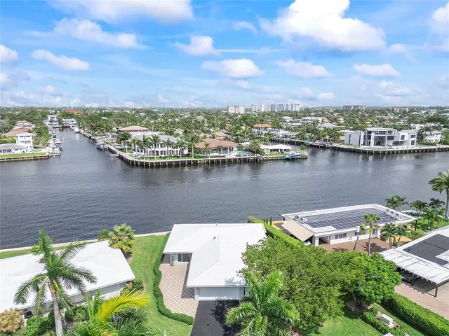 a kitchen with a stove a refrigerator and a dining table