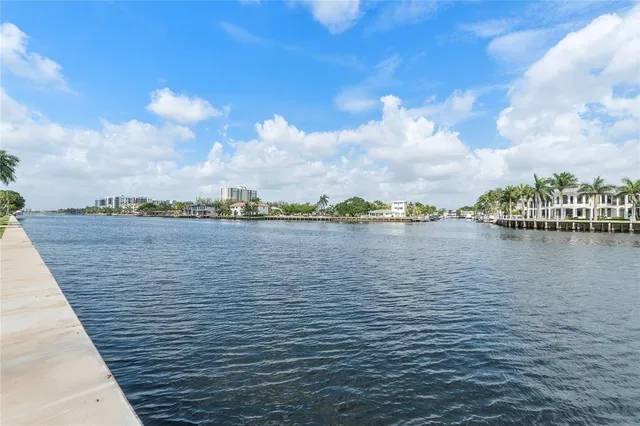 a living room with furniture fireplace and window