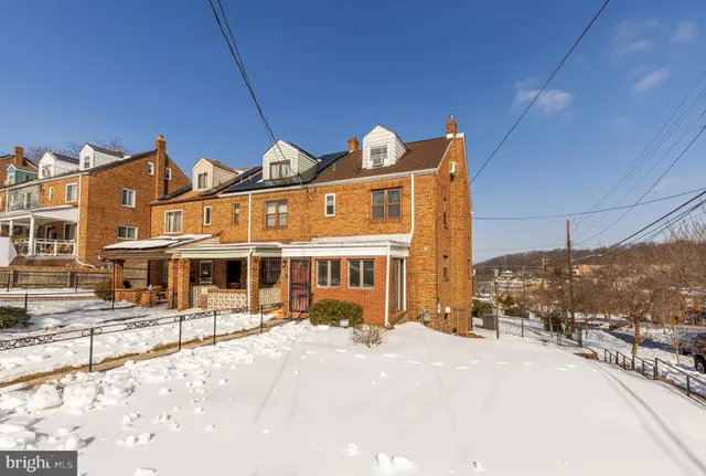 a front view of a building with a street