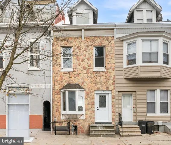 a view of a building with car parked