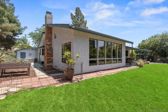 a view of a back yard of the house
