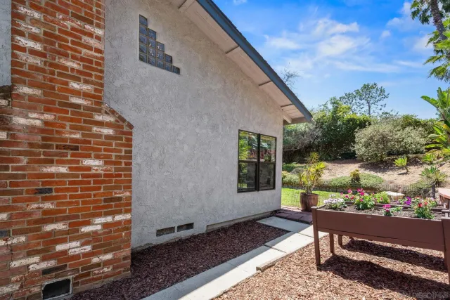 a front view of house with yard and outdoor seating