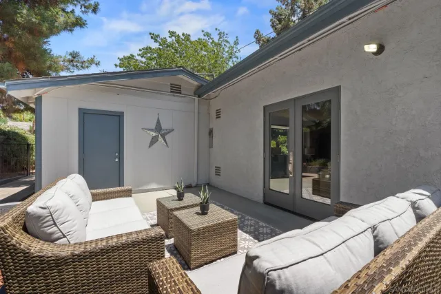 a living room with furniture fireplace and flat screen tv