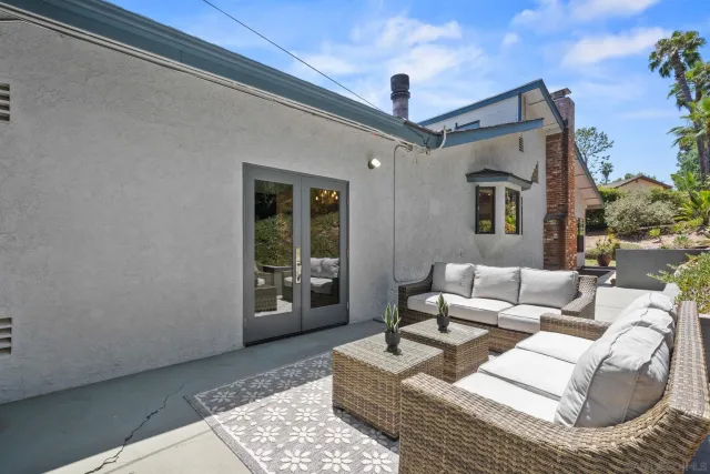 a bathroom with a sink a toilet a mirror a vanity and shower
