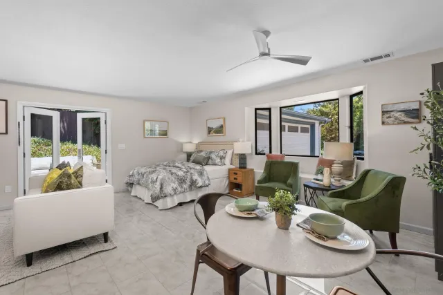 a kitchen with a table and chairs in it