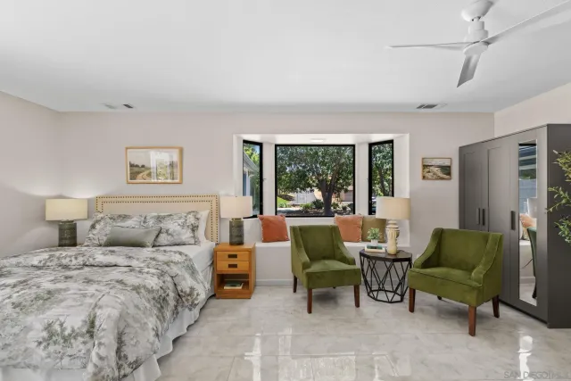 a kitchen with stainless steel appliances white cabinets and a refrigerator