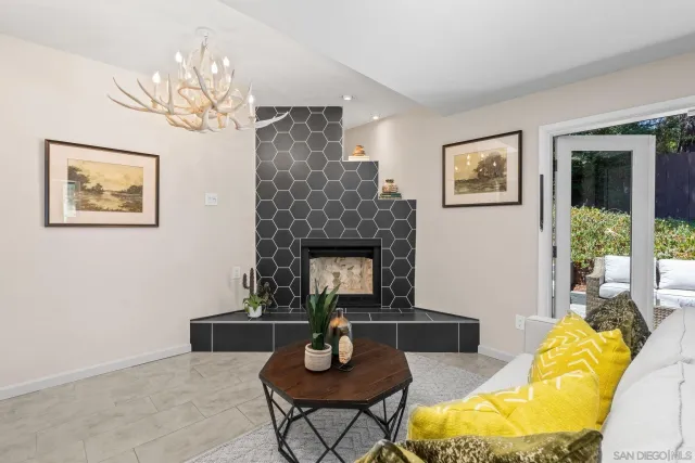 a kitchen with a stove a sink dishwasher and cabinets with wooden floor