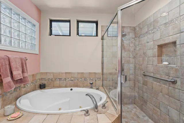 a bedroom with a bed and a desk