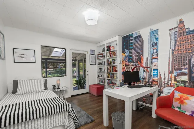 a bedroom with bed and a window