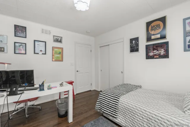 a bedroom with a bed and a table in it