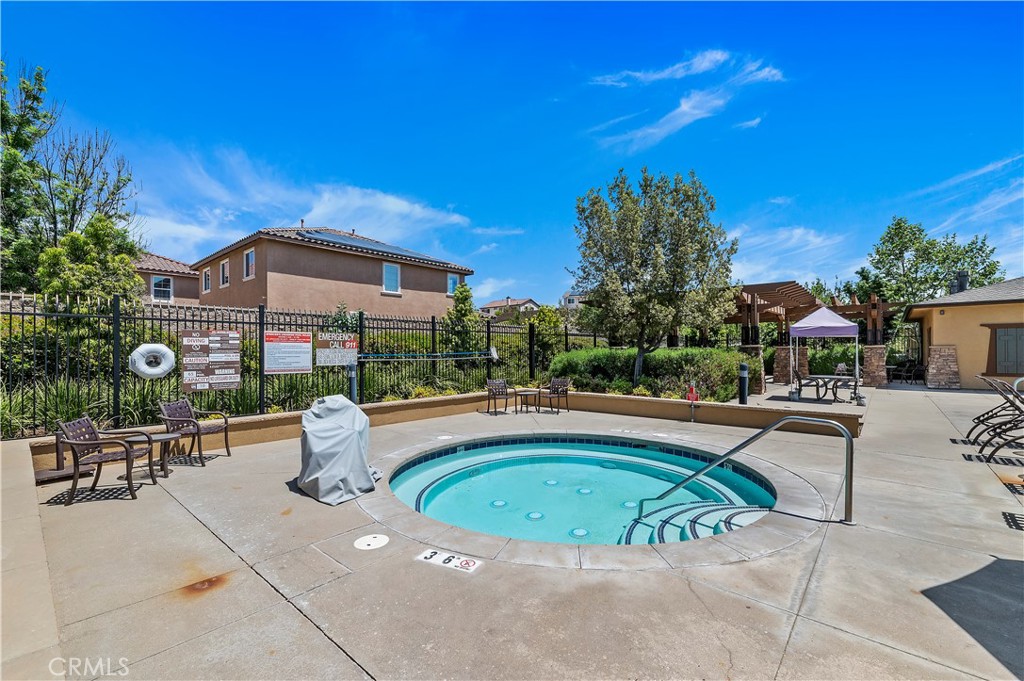 34108 Helenium Street Murrieta, CA 92563 - Photo 11 of 14 a view of a swimming pool with a patio